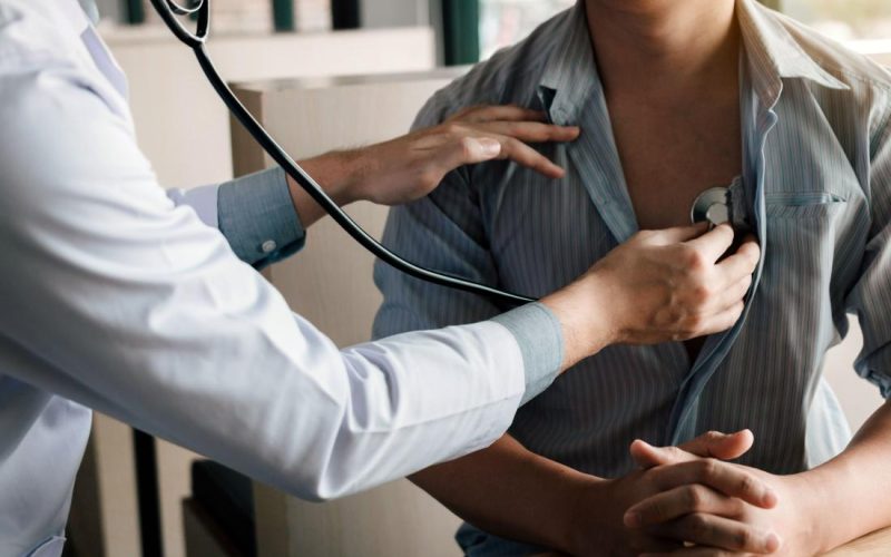 doctor-performs-physical-examination-on-patient-with-stethoscope